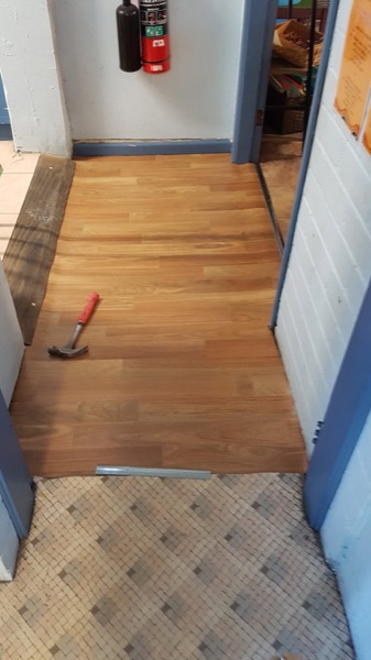A new timber floor laid along a hallway